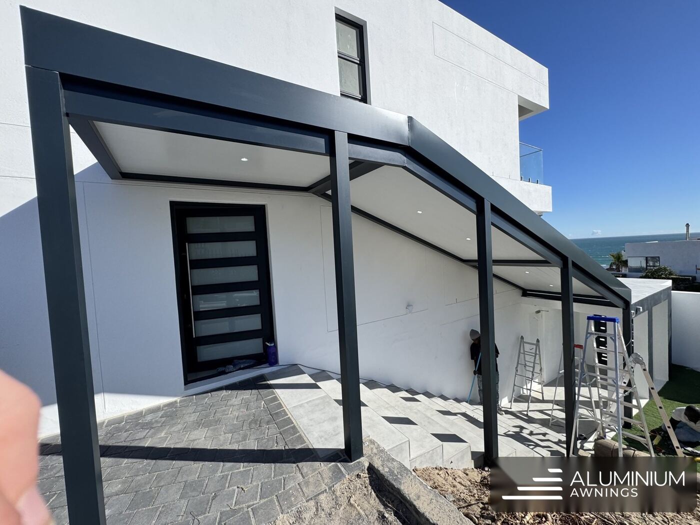 Lined aluminium patio ceiling with recessed downlights